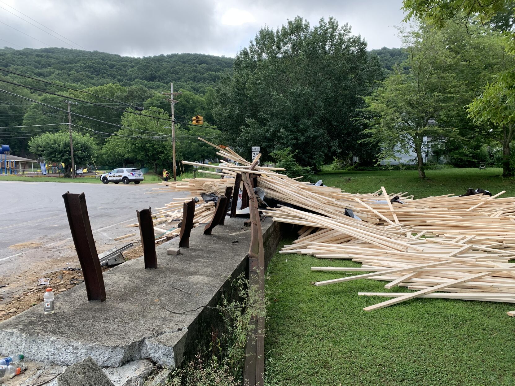 Another truck collides with Joe's Truck Stop, spilling lumber